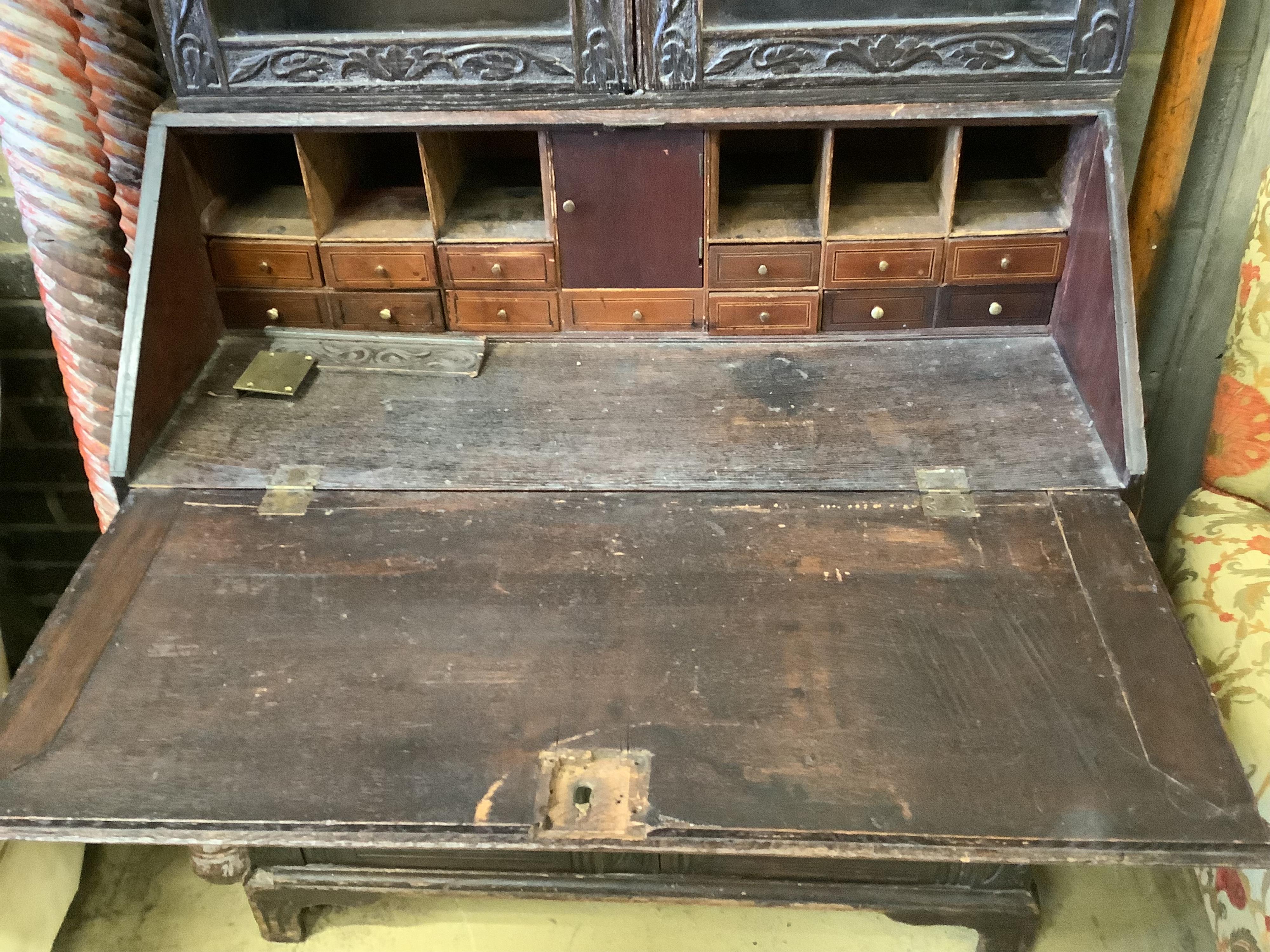 A Victorian carved oak bureau bookcase, width 94cm, depth 54cm, height 203cm